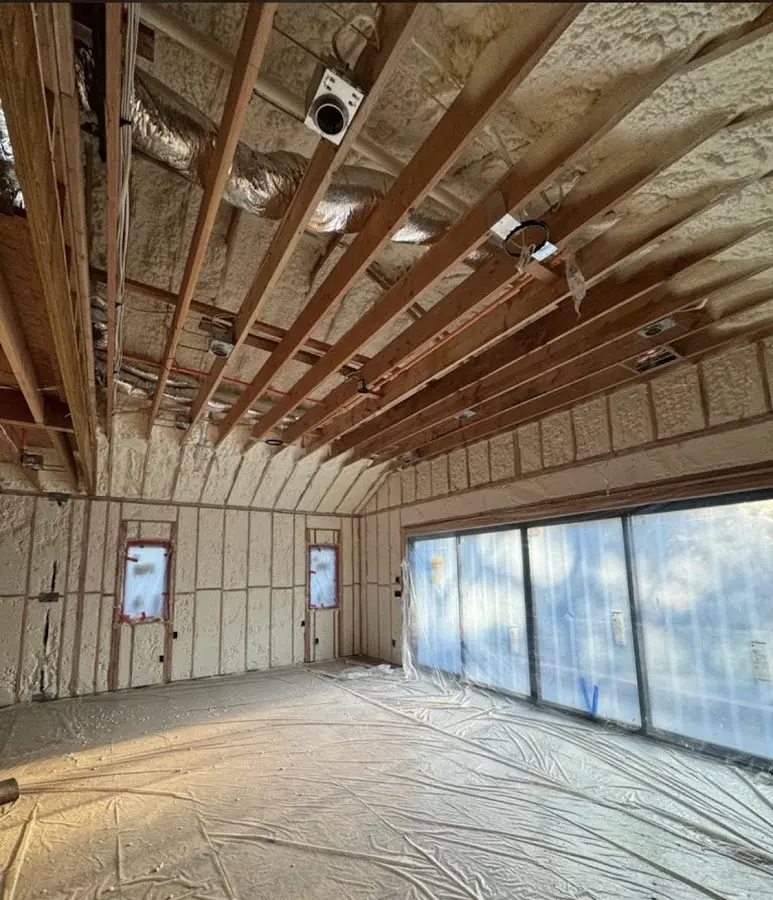 Interior walls and ceiling insulated with spray foam during new construction in New Albany